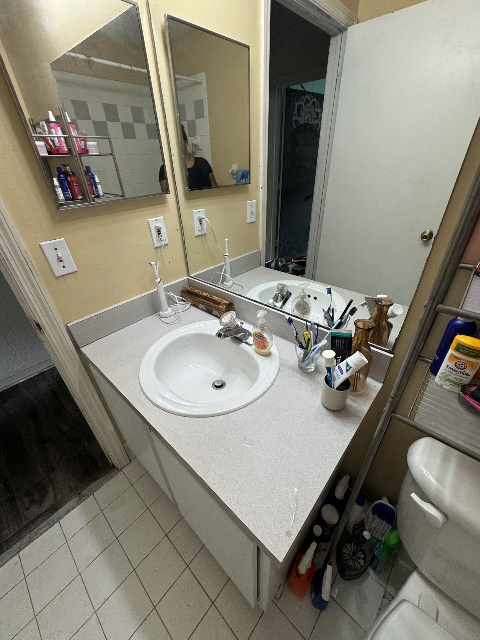 Clean bathroom vanity with polished sink and mirror after professional residential cleaning services in Dallas, TX.